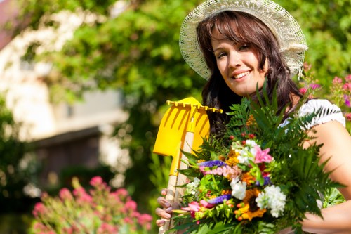 Team member using safe handling practices during garden maintenance